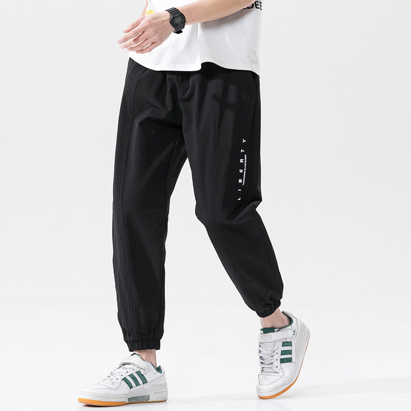 Summer men's casual exercise trousers Korean version of the tide loose Oversize beam adolescents nine-point guards alfamoba