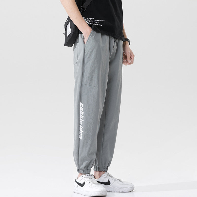 Summer men's casual exercise trousers Korean version of the tide loose Oversize beam adolescents nine-point guards alfamoba