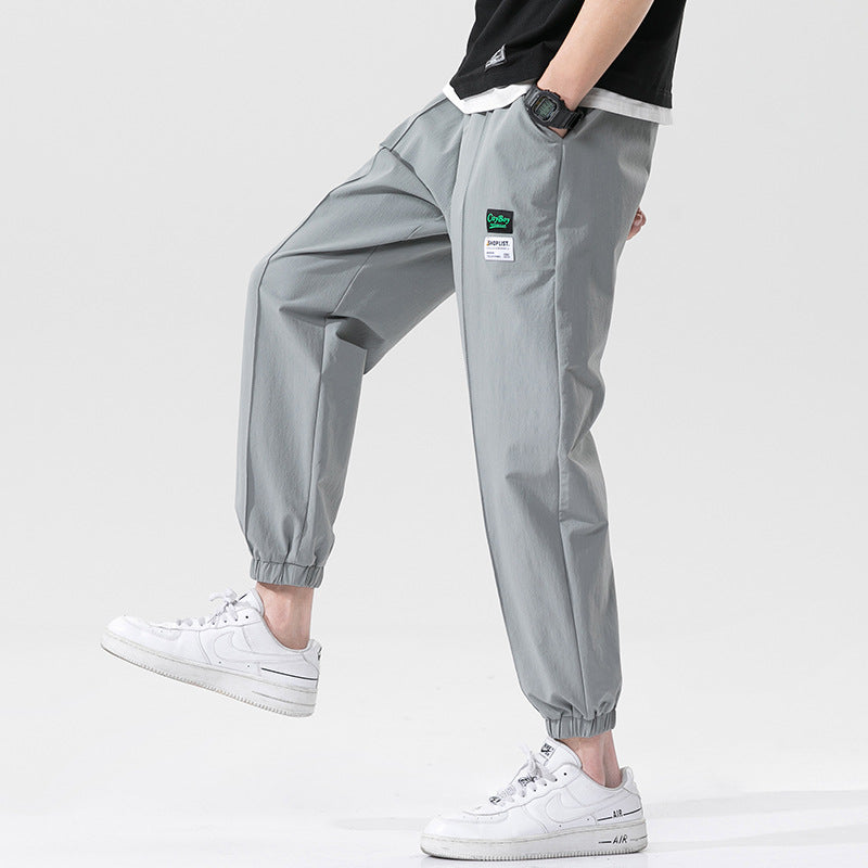 Summer men's casual exercise trousers Korean version of the tide loose Oversize beam adolescents nine-point guards alfamoba