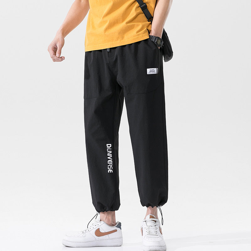 Summer men's casual exercise trousers Korean version of the tide loose Oversize beam adolescents nine-point guards alfamoba