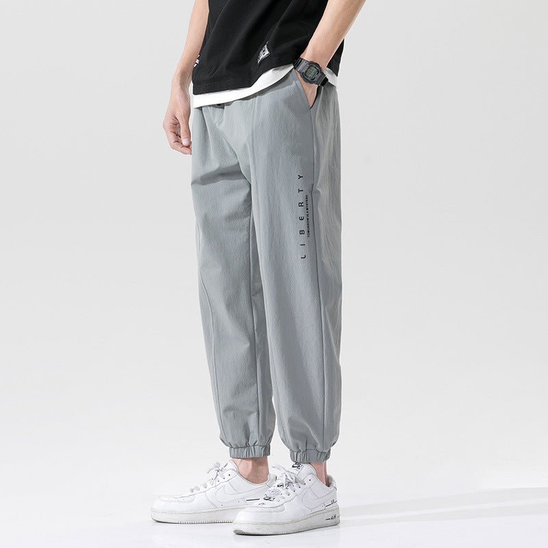 Summer men's casual exercise trousers Korean version of the tide loose Oversize beam adolescents nine-point guards alfamoba